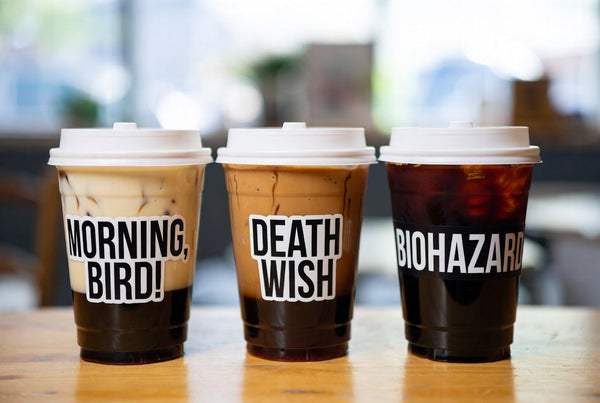 Three coffee cups side by side labeled Morning, Bird!, Death Wish, and Biohazard
