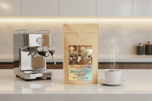 Hummingbird! Blend - High Caffeine Coffee - Espresso Grind bag beside an espresso machine and cup of coffee.